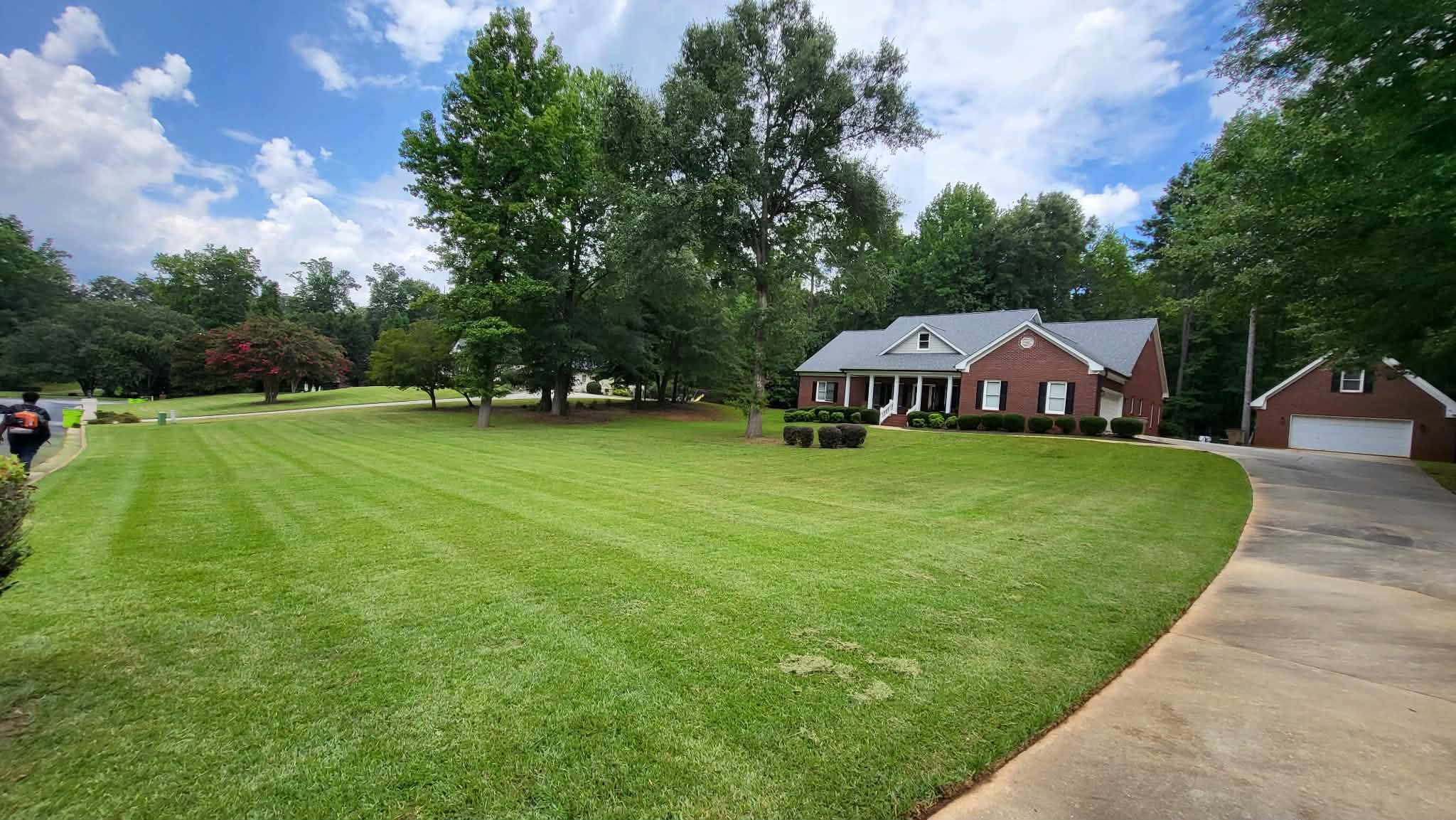 Brick home with manicured lawn